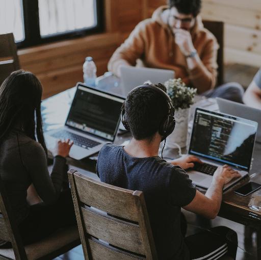 group of people using laptop computer